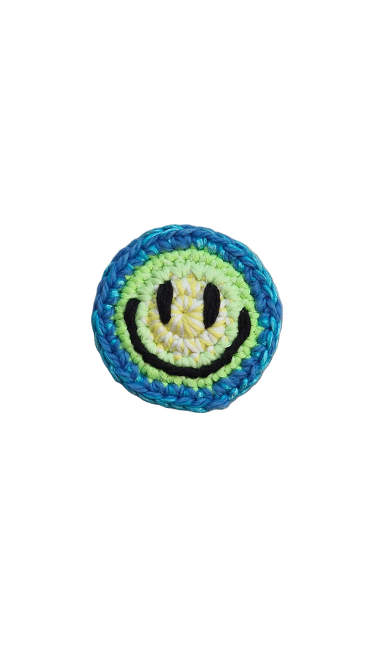 Hand-crochet acid house face badge electric blue multicolour 90s rave pin Free Range Smilies Qravers London