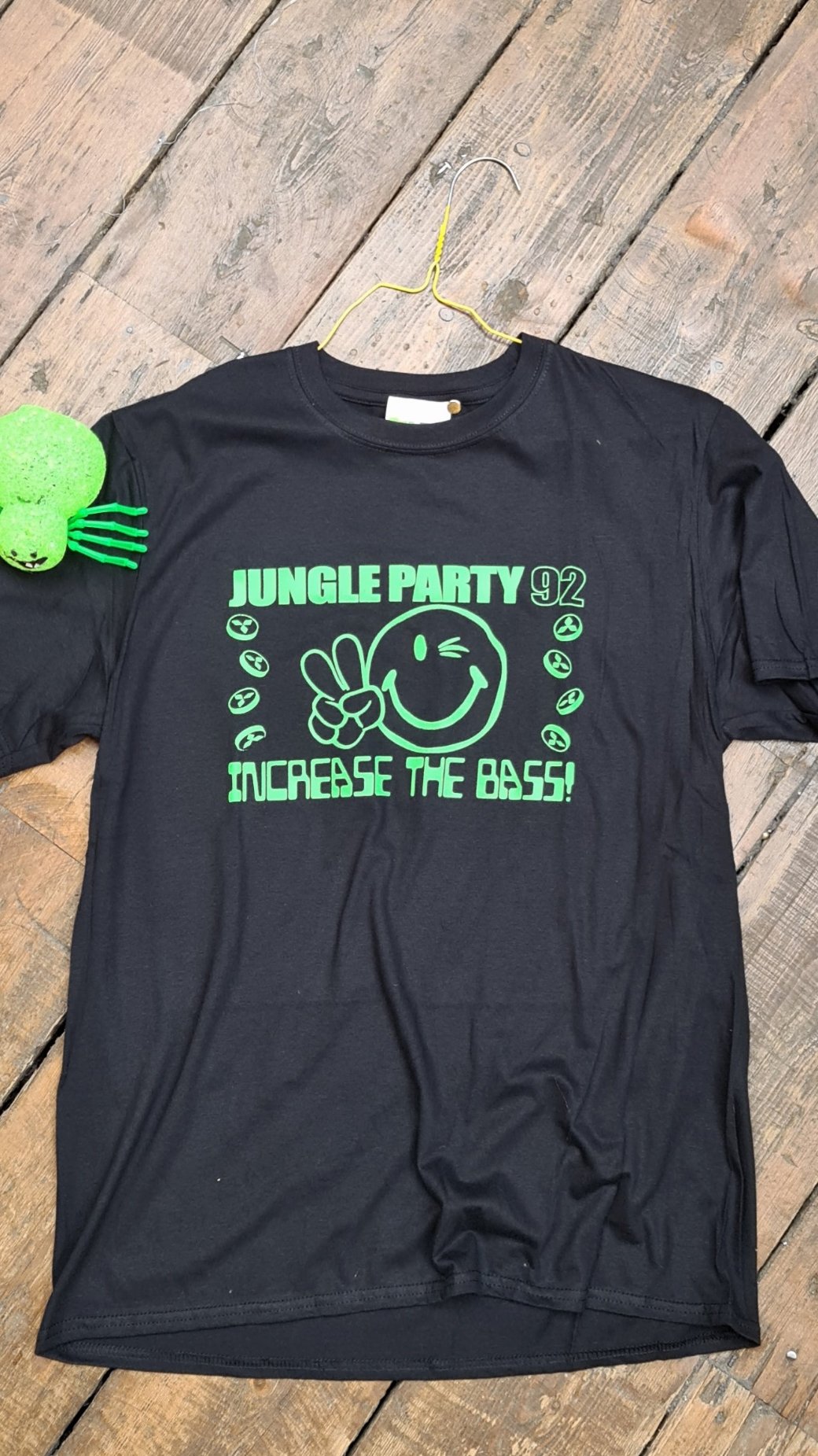 flat lay black Jungle Party 92 t-shirt with green 90s jungle rave graphic front view