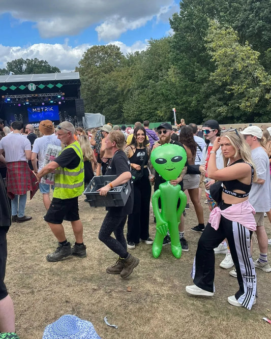 Qravers festival survival guide UK rave clothing waterproof bags bombers inflatable alien festival gear