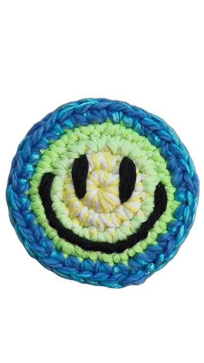 Hand-crochet acid house face badge electric blue 90s rave pin Free Range Smilies Qravers London