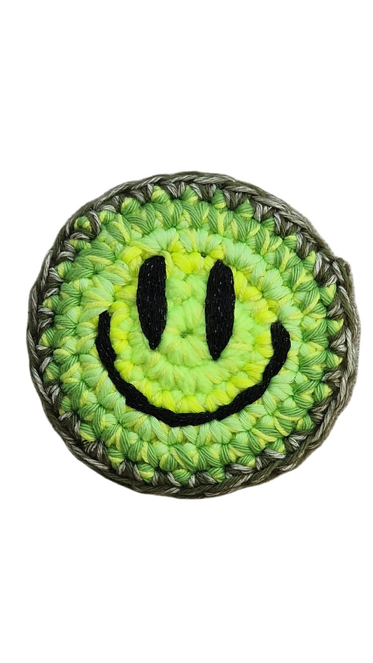 Hand-crochet acid house smile face badge neon lime yellow 90s rave pin Free Range Smiles Qravers London