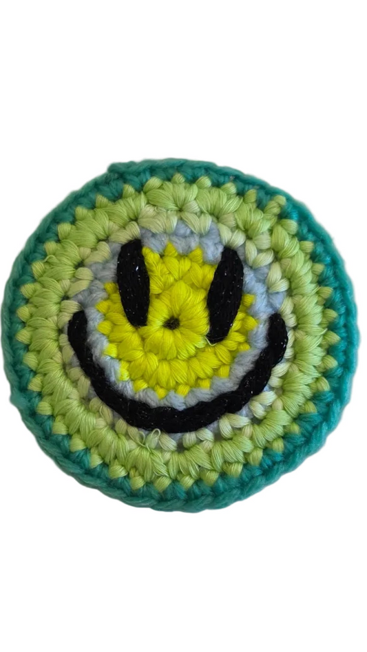 Hand-crochet acid house smile face badge neon lime yellow 90s rave pin Free Range Smiles Qravers London