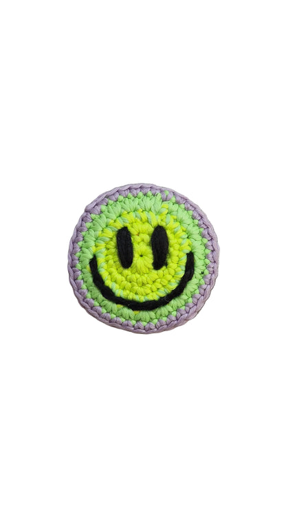 Hand-crochet acid house face badge rainbow burst multicolour 90s rave pin Free Range Smilies Qravers London