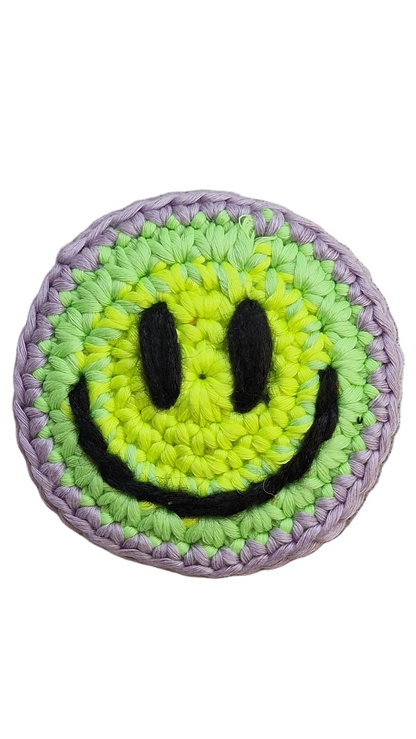 Hand-crochet acid house face badge rainbow burst multicolour 90s rave pin Free Range Smilies Qravers London